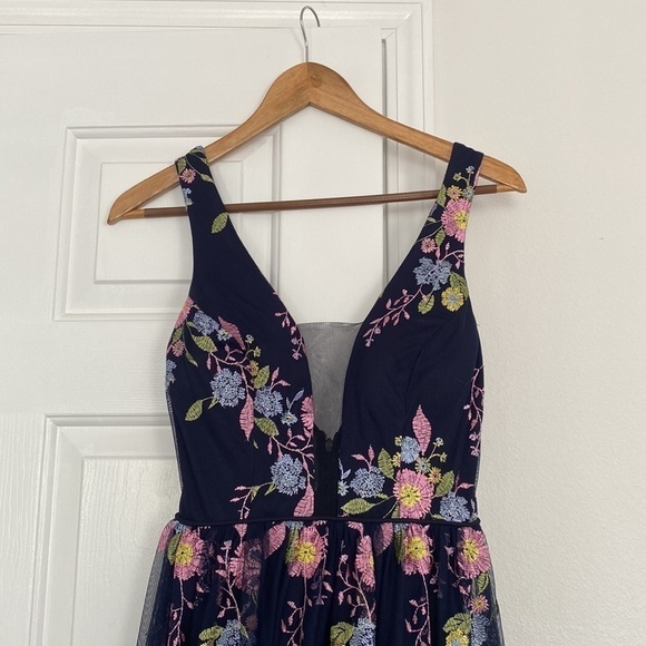 GB formal gown in navy with embroidered pink, yellow, and blue flowers. - Picture 3 of 15